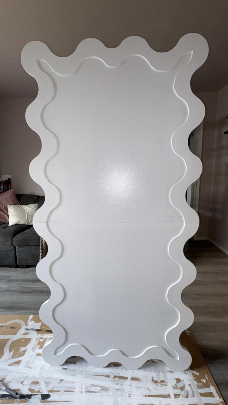 Wavy mirror frame